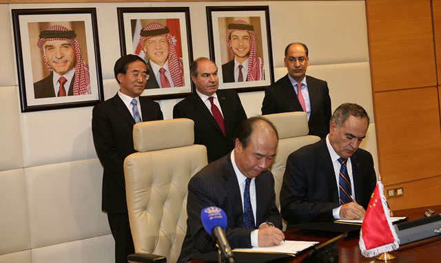 APC and Sinochem Group representatives sign a three-year agreement in Amman on Sunday (Petra photo)