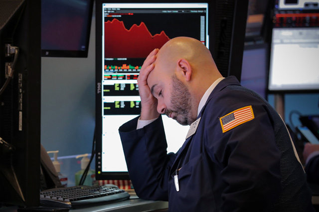 A trader works on the floor of the New York Stock Exchange in New York, US, on Tuesday (Reuters photo)