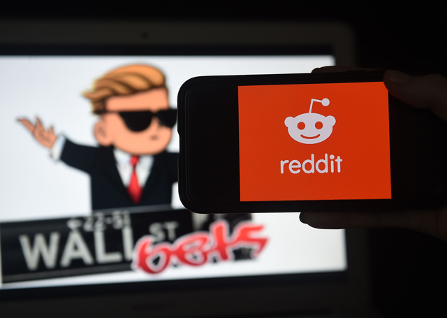 This photo illustration shows the logo of WallStreetBet on a computer and the Reddit logo on a mobile phone in Arlington, Virginia, on Friday (AFP photo)
