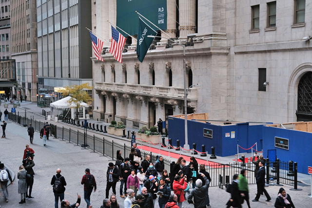 People walk by the New York Stock Exchange on Monday in New York City, US  (AFP photo)