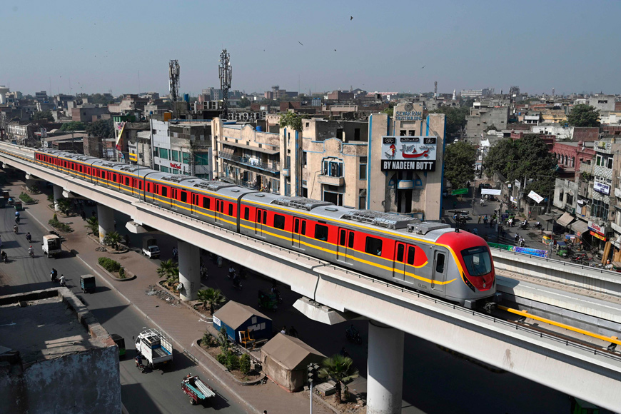 A newly built Orange Line Metro Train, a metro project planned under the China-Pakistan Economic Corridor, drives through on a track after an official opening in the eastern city of Lahore, on Monday (AFP photo)