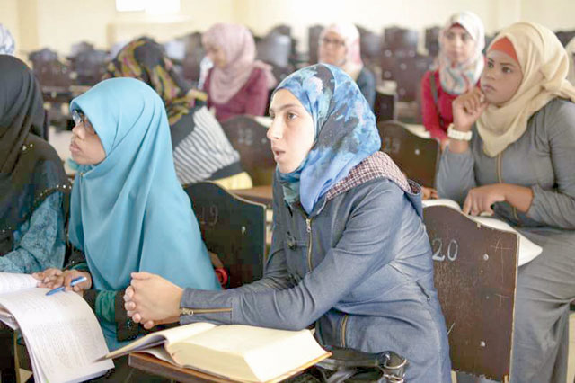 Students during an Arabic literature class at Al al-Bayt University in Mafraq. Despite a higher than global average of young refugees attending tertiary education in the region, only 5 per cent of those eligible age doing so, according to a recent UNHCR report (Photo courtesy of UNHCR)
