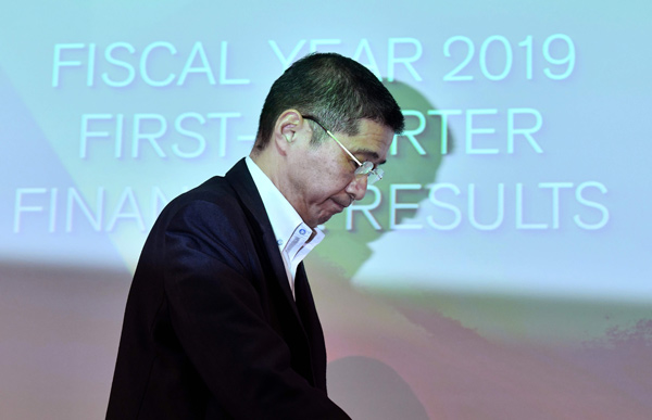 Nissan Motors President and CEO Hiroto Saikawa leaves a press conference after announcing first quarter financial results at the company headquarters in Yokohama on Thursday. Crisis-hit Japanese automaker Nissan said its net profit plunged nearly 95 per cent in the first quarter due to slumping sales and growing costs (AFP photo)