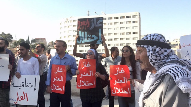 Activists protest against the gas deal with Israel in front of Parliament on Tuesday (Photo by Suzanna Goussous)