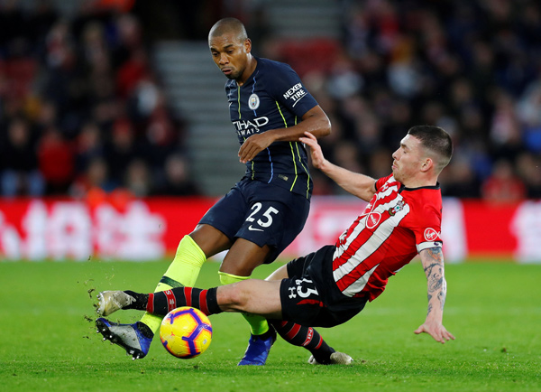 Southampton's Pierre-Emile Hojbjerg fouls Manchester City's Fernandinho leading to a red card on Sunday (Reuters photo)