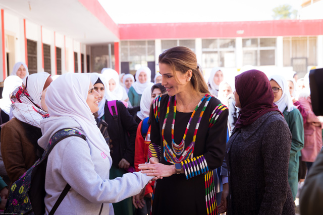 Her Majesty meets with students at the Lubaba Bint Al Hareth Secondary School for Girls, on Wednesday (Photo courtesy of Royal Court)