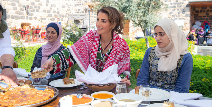   Her Majesty Queen Rania meets with youth during a visit to Muhafazati Volunteering Foundation in Irbid on Monday (Photo courtesy of Royal Court)