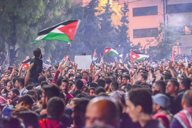 Protesters gathering near the Fourth Circle in Amman in June, calling for the withdrawal of the income tax draft law from Parliament  (JT file photo)