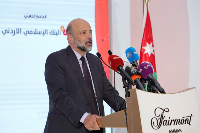   Prime Minister Omar Razzaz delivers his inaugural address during the Jordanian Expatriates Conference on Tuesday (Petra photo)
