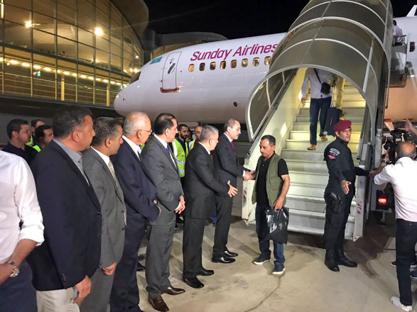 Foreign Minister Ayman Safadi greets Jordanian engineers upon their arrival at Amman airport on Tuesday, who were assaulted while working in Kazakhstan earlier this week (Photo courtesy of Foreign Ministry)