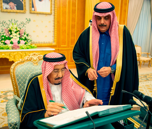 This handout photo provided by the Saudi Press Agency on Tuesday shows Saudi Arabia's King Salman Bin Abdulaziz signing on the 2019 budget following a meeting in Riyadh (AFP photo)