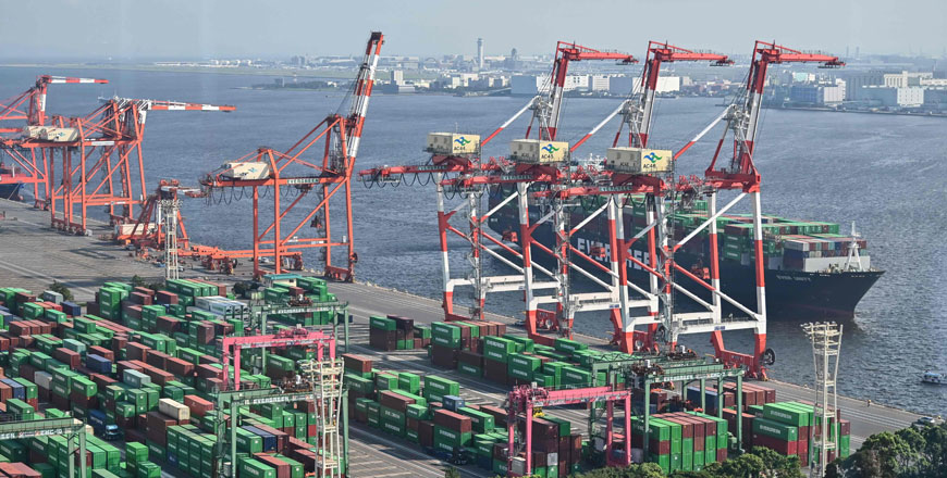 Containers and a cargo ship are seen at the international cargo terminal at the port in Tokyo on Monday (AFP photo)
