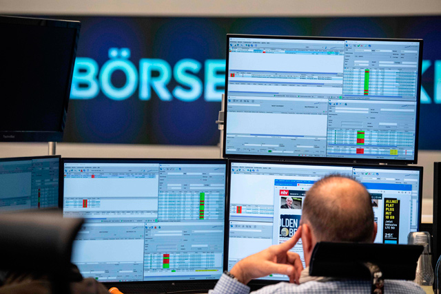 A trader works at the stock exchange in Frankfurt am Main, western Germany, on Monday (AFP photo)