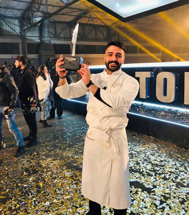   In this undated photo, Ali Ghzawi holds the Top Chef trophy after becoming the first Jordanian to win the competition  (Photo courtesy of Facebook)