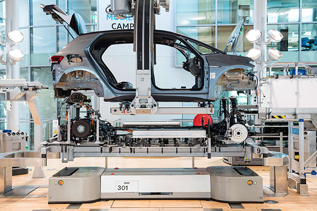 In this file photo taken on June 8, 2021, the body of a car is seen at the assembly line for the Volkswagen (VW) ID 3 electric car of German carmaker Volkswagen, at the 'Glassy Manufactory' (Glaeserne Manufaktur) production site in Dresden, eastern Germany. (AFP photo)