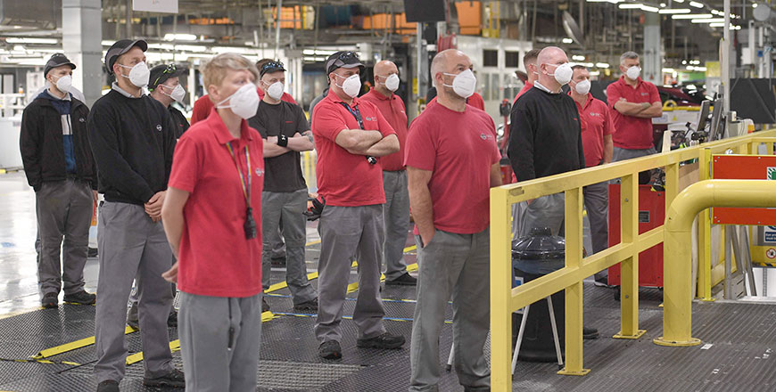 Nissan employees listen to the announcement of the construction of a gigafactory at Nissan's  plant in Sunderland, north east England on Thursday. (AFP photo)