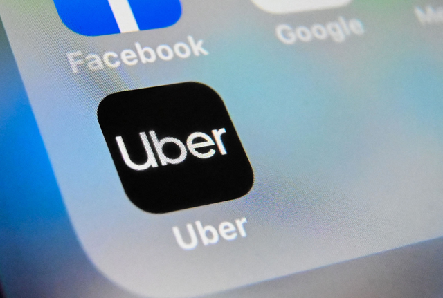 Uber, whose logo is seen in this photo, on Friday said it will let drivers in the US see trip details before deciding whether to accept them (AFP file photo)