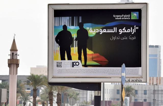 In this file photo taken on November 11, 2019, a billboard displaying an advert for Aramco is pictured in the Saudi capital Riyadh. Oil giant Saudi Aramco unveiled record profits of $48.4 billion in the second quarter on Sunday after Russia's war in Ukraine and a post-pandemic surge in demand sent crude prices soaring (AFP photo)