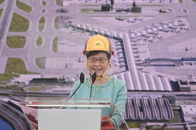 Hong Kong Chief Executive Carrie Lam speaks at a ceremony for the completion of the third Runway pavement at Chek Lap Kok airport in Hong Kong on Tuesday (AFP photo)