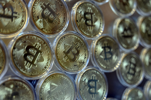 This file photo taken on December 17, 2020 shows a physical imitation of a Bitcoin at a cryptocurrency 'Bitcoin Change' shop in Istanbul (AFP photo)