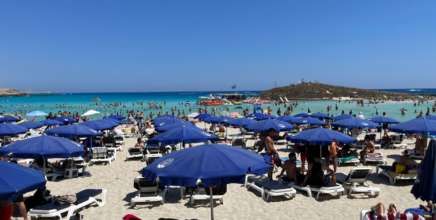 Beachgoers relax at Nissi Beach in the Cypriot resort town of Ayia Napa, one of the Mediterranean island's top tourist destinations, on July 17 (AFP photo)