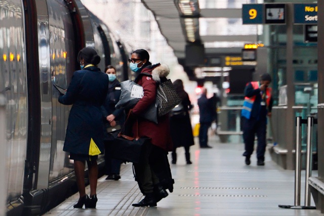 The last passengers board a Eurostar train bound for Paris as it prepares to leave St Pancras International train station in London on Monday (AFP photo)