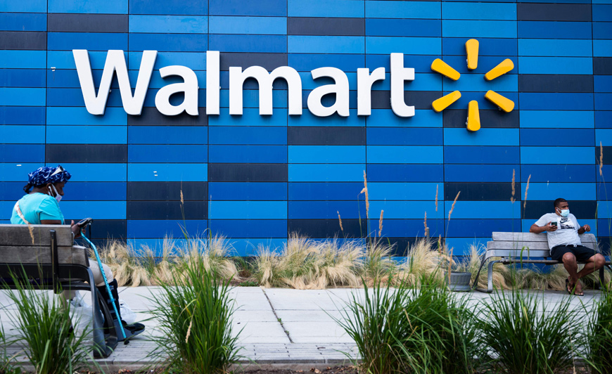 In this file photo taken on July 15, 2020, people sit outside a Walmart store in Washington, DC (AFP photo)