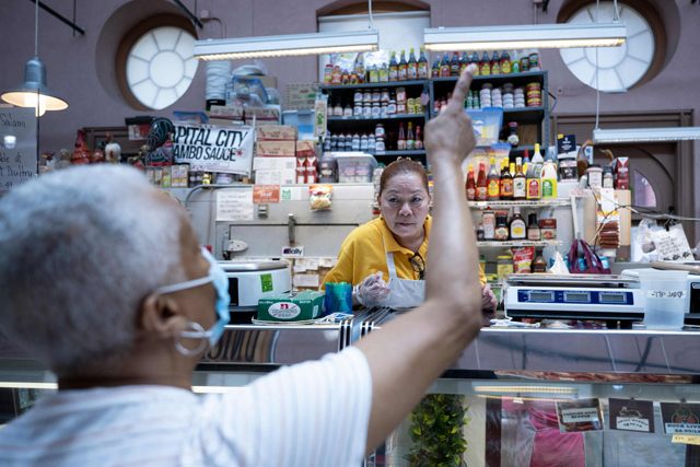 This photo shows a man shopping at Eastern Market in Washington, DC, on Friday as the US struggles with rising inflation (AFP photo)
