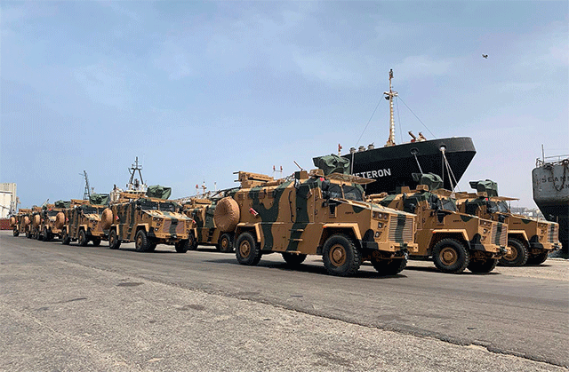 A file photo posted on the Facebook Page of the media bureau of 'Volcano of Anger' operation on May 18, 2019, reportedly shows Turkish-made armoured personnel vehicles, shipped to Libya's UN-recognised Government of National Accord (GNA), arriving at Tripoli Port (AFP photo)