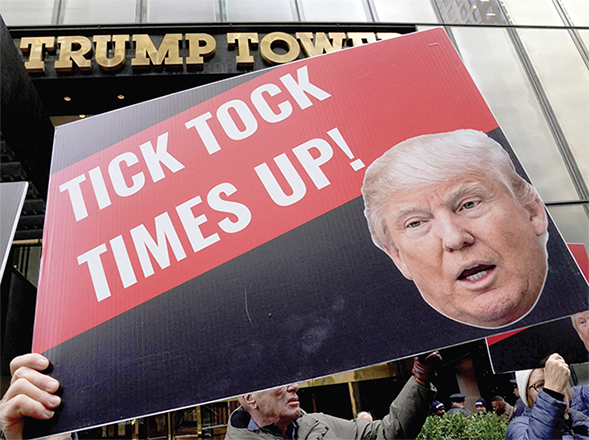 Protesters gather in front of Trump Tower in New York City on Friday (AFP photo)