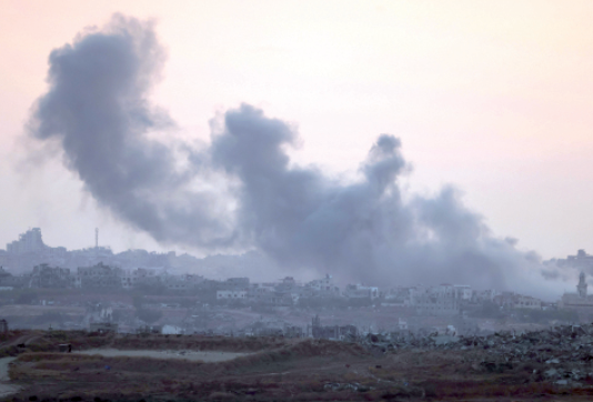 This photo taken from a position along Israel's southern border with the Gaza Strip shows smoke billowing over the Palestinian territory following Israeli bombardment on Tuesday (AFP photo)
