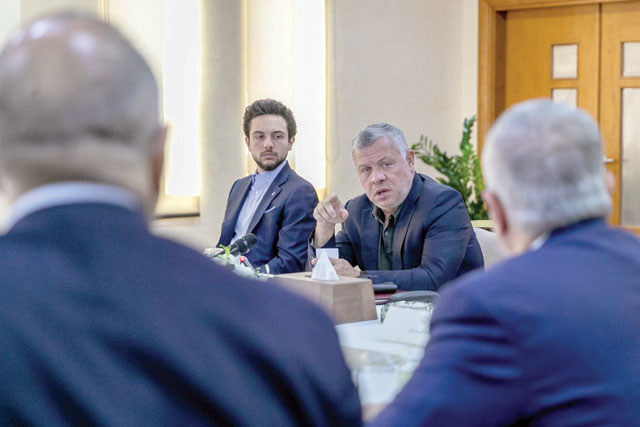 His Majesty King Abdullah, accompanied by HRH Crown Prince Hussein, meets with the chief commissioner of Aqaba Special Economic Zone Authority and members of its board of commissioners, as well as officials from companies affiliated with ASEZA in Aqaba on Sunday (Photo courtesy of Royal Court)