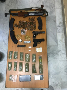 Drugs and firearms are displayed by the authorities following drug raids on Sunday  (Photo courtesy of PSD Facebook page)