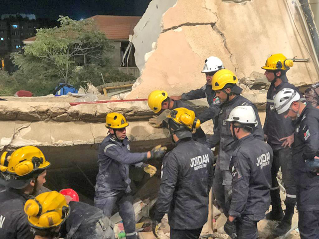 Rescue workers are seen at the site of the building collapse in Jabal Weibdeh on Tuesday (Photo courtesy of PSD)