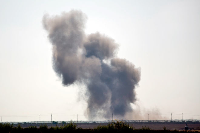 Smoke rises following an explosion in Egypt’s northern Sinai Peninsula, as seen from the Israel-Egypt border, near Kerem Shalom town, southern Israel, on Wednesday (AP photo)