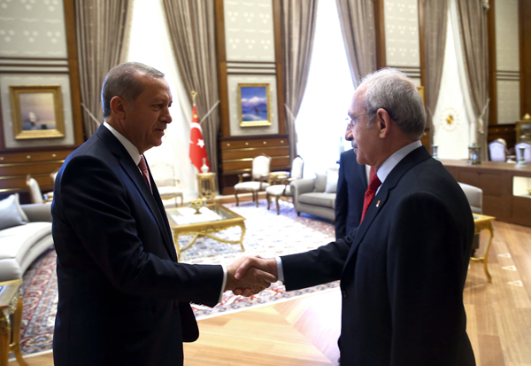 Turkey's President Recep Tayyip Erdoganl (left), greets Kemal Kilicdaroglu before a meeting in Ankara, Turkey on Monday (AP photo)