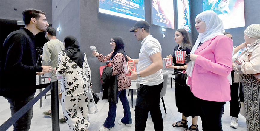 People enter one of the auditoriums of the Algerian TMV group’s multiplex inside the Garden City mall in Algiers on September 7, 2023 (AFP photo)