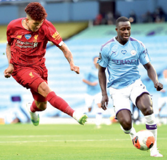 Liverpool take on Manchaster United on Sunday  (AFP photo by Peter Powell)