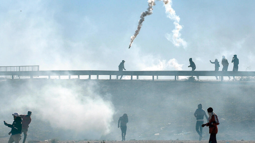 Smoke billows from tear gas fired by Tunisian security forces in the town of Agareb on Thursday, two days after the death of a protester during angry demonstrations over the reopening of a rubbish dump  (AFP photo)