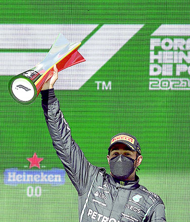 Mercedes’ British driver Lewis Hamilton celebrates on the podium after winning the Portuguese Formula One Grand Prix race at the Algarve International Circuit in Portimao on Sunday (AFP photo by Patricia De Melo Moreira)