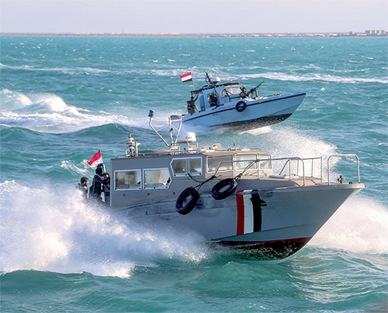 Yemeni coast guard members loyal to the internationally-recognised government ride in a speed boat and a patrol boat cruising in the Red Sea off of the government-held town of Mokha in the western Taiz province, close to the strategic Bab Al Mandab Strait, on Tuesday (AFP photo)