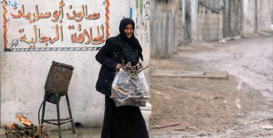 A woman walks in a muddy alley at the camp of Atme for displaced people, on the outskirts of Idlib in northwestern Syria, on February 5, 2025, nearly two months after Islamist-led rebels toppled Syrian president Bashal Al Assad (AFP photo)