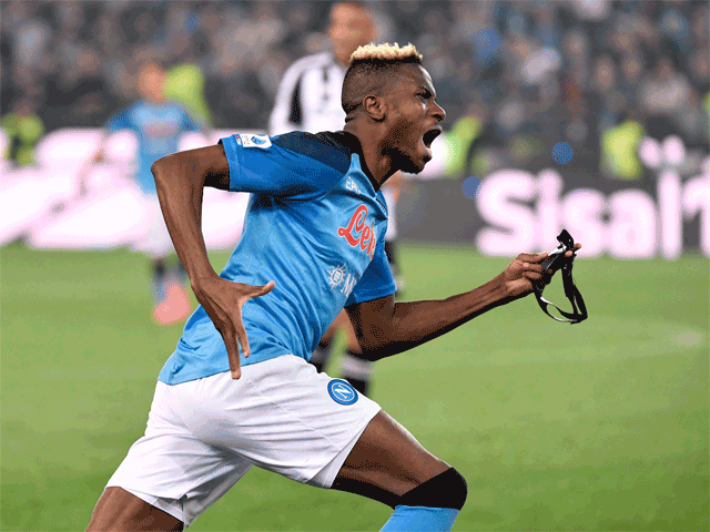 Napoli’s forward Victor Osimhen celebrates Napoli winning the Scudetto title after the referee blew the final whistle of the Italian Serie A match against Udinese in Udine on Thursday (AFP photo by Andrea Staccioli)