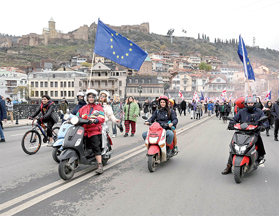 Georgians stage a pro-EU march in the capital Tbilisi on Saturday, days before the bloc is expected to put the Black Sea nation on a formal membership path (AFP photo)