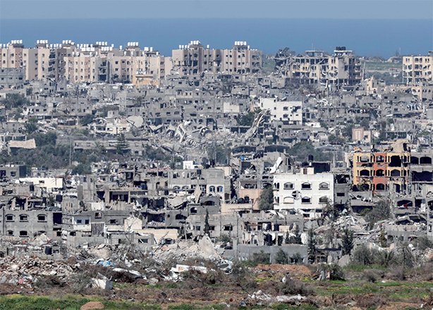 A photo taken from a position in southern Israel on Thursday shows destroyed buildings in the Gaza Strip, amid ongoing battles between Hamas and Israel (AFP photo)