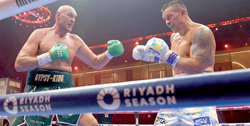 Ukraine’s Oleksandr Usyk (right) fights against Britain’s Tyson Fury during a heavyweight boxing world championship fight at Kingdom Arena in Riyadh, Saudi Arabia on Sunday (AFP photo)
