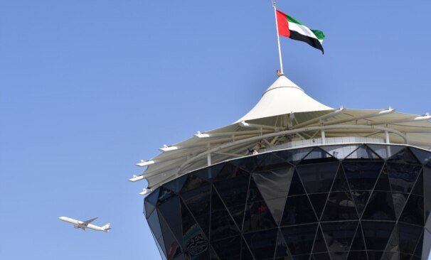 An Etihad Airways plane flies over the main control tower at the Yas Marina circuit ahead of the start of the Abu Dhabi Formula One Grand Prix on November 27, 2016 (AFP file photo)