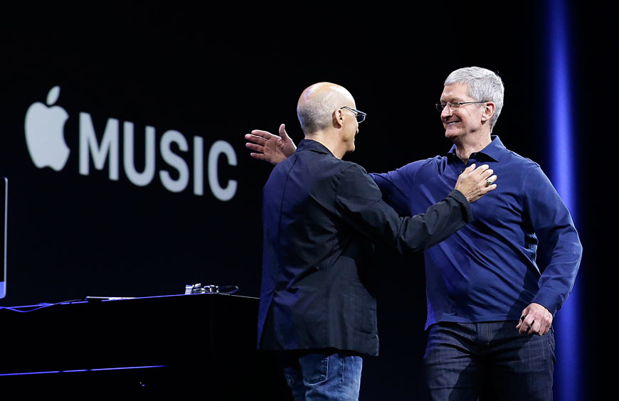 Apple CEO Tim Cook (right) hugs Beats by Dre co-founder and Apple employee Jimmy Iovine at the Apple Worldwide Developers Conference in San Francisco on Monday (AP photo)