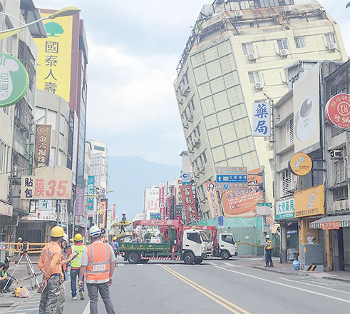 This photo released by Taiwan’s Central News Agency on Tuesday shows the Full Hotel building in Hualien, which had been previously damaged in the April 3 earthquake, tilting further to one side after a series of earthquakes overnight (AFP Photo by CNA / AFP)