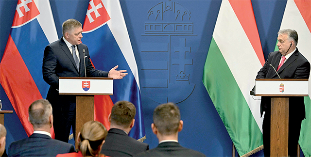 Hungary’s Prime Minister Viktor Orban (right) and his Slovakian counterpart Robert Fico address a joint press conference at Carmelita monastery, the Hungarian Prime Minister’s office in Budapest, on Tuesday (AFP photo)